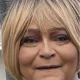 Close-up of woman with short blonde bob haircut