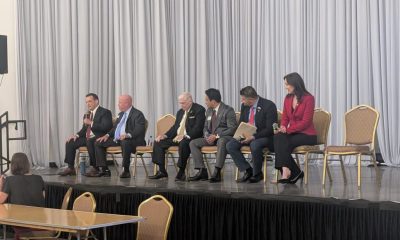 Panel discussion with six speakers on stage