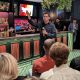 Man speaking with microphone at bar event
