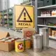 Food recall warning sign with canned goods