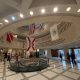 Interior rotunda of state capitol building with flags