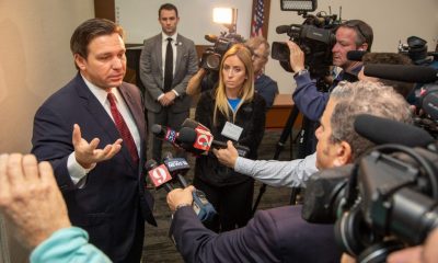 Politician speaking to reporters at press conference