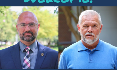 City of Pensacola welcome banner with two officials