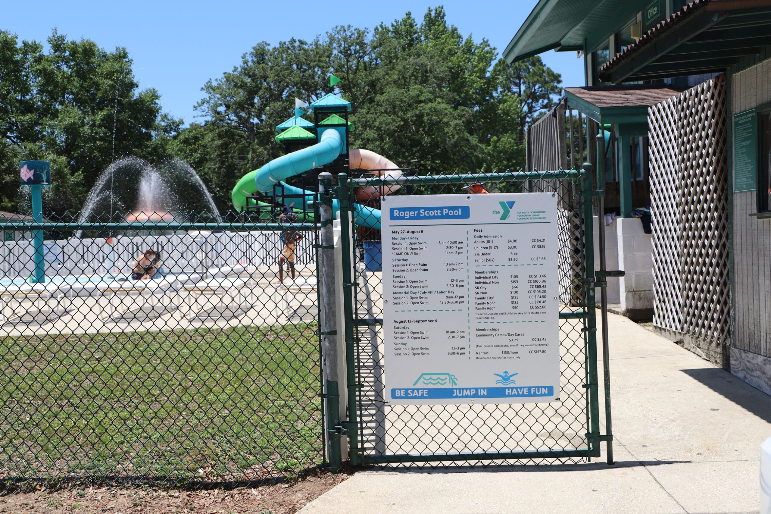 Entrance gate to Roger Scott Pool with slides