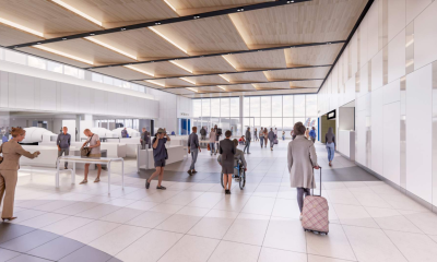 Modern airport security checkpoint with travelers walking