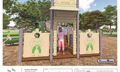 Children playing on western-themed playground structure