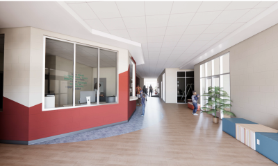 Modern school hallway with reception and students