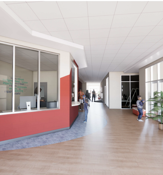 Modern school hallway with reception and students — Fricker Resource Center Pensacola renovation