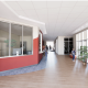 Modern school hallway with reception and students