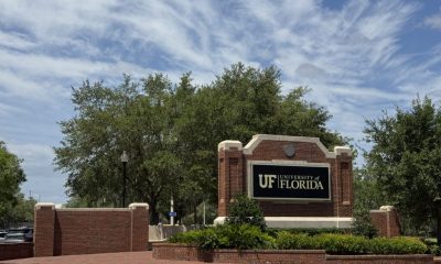 University of Florida entrance sign on brick wall