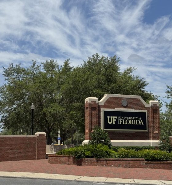 University of Florida entrance sign on brick wall