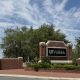 University of Florida entrance sign on brick wall