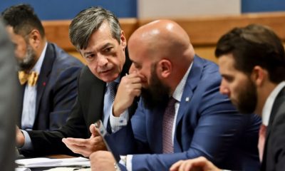 Men in suits discussing at conference table