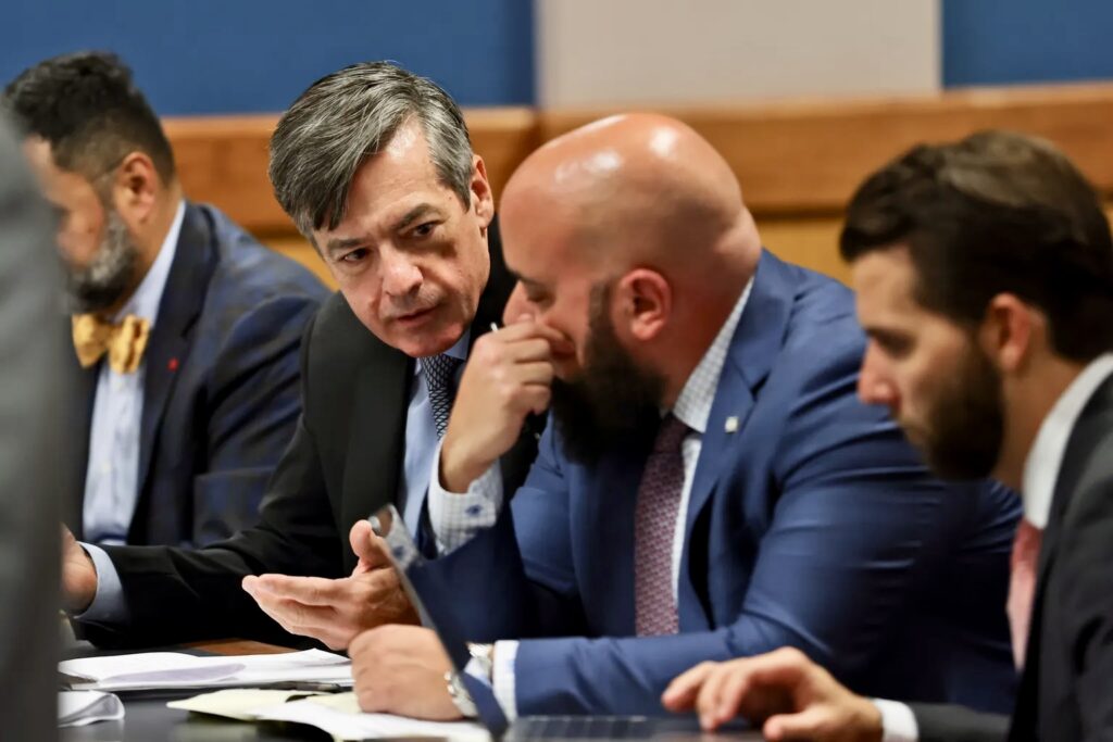 Men in suits discussing at conference table