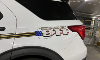 Emergency 911 decal on white SUV