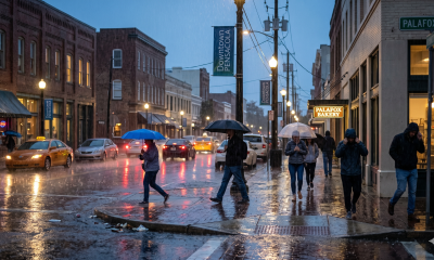 Rainy evening in downtown Pensacola with umbrellas