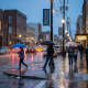 Rainy evening in downtown Pensacola with umbrellas