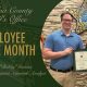 Sheriff presenting Employee of the Month certificate