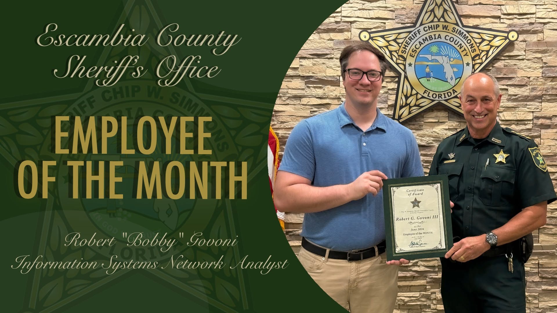 Sheriff presenting Employee of the Month certificate