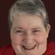 Smiling older woman with short gray hair