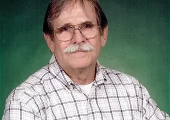 Older man with glasses and mustache portrait