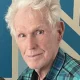 Elderly man with white hair and plaid shirt