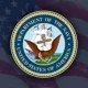Department of the Navy seal over U.S. flag
