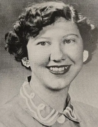 Black-and-white portrait of smiling young woman