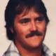 Vintage portrait of mustached man with dark hair