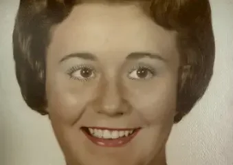 Vintage portrait of smiling woman with short brown hair