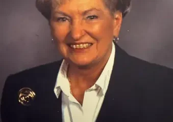 Smiling older woman in blazer portrait