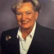 Smiling older woman in blazer portrait