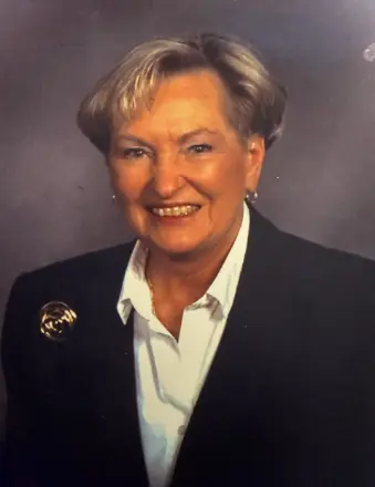 Smiling older woman in blazer portrait