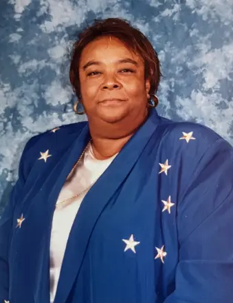 Woman in blue star-patterned blazer portrait