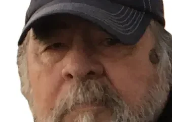 Older bearded man wearing Old Guys Rule cap