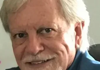 Older man with white hair and beard