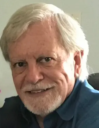 Older man with white hair and beard