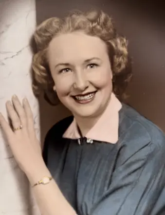 Smiling woman in vintage portrait beside marble column