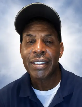 Man wearing cap against neutral background
