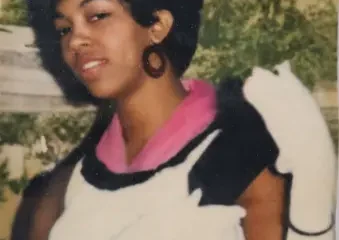 Vintage portrait of woman with afro hairstyle outdoors
