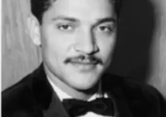 Black-and-white portrait of man in tuxedo