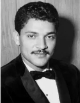 Black-and-white portrait of man in tuxedo