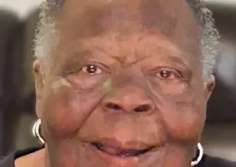 Smiling elderly woman with short gray hair