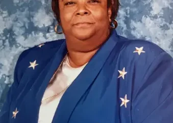 Woman in blue star-patterned jacket portrait