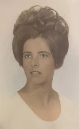Vintage portrait of woman with voluminous updo hairstyle