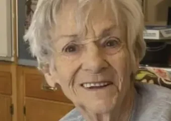 Smiling elderly woman in a kitchen