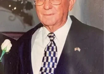 Elderly man in suit with patterned tie