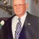 Elderly man in suit with patterned tie