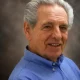 Smiling older man in blue shirt portrait