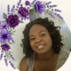 Smiling woman framed by purple floral border